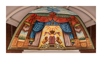 a painted mural of a stage with red and blue curtains, two lions, and the middle has a crown.