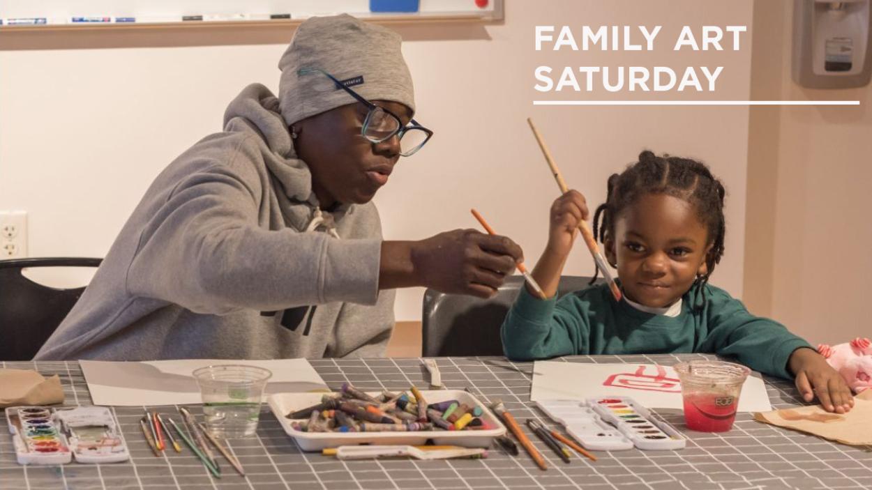 Adult and child making art together at BCA.