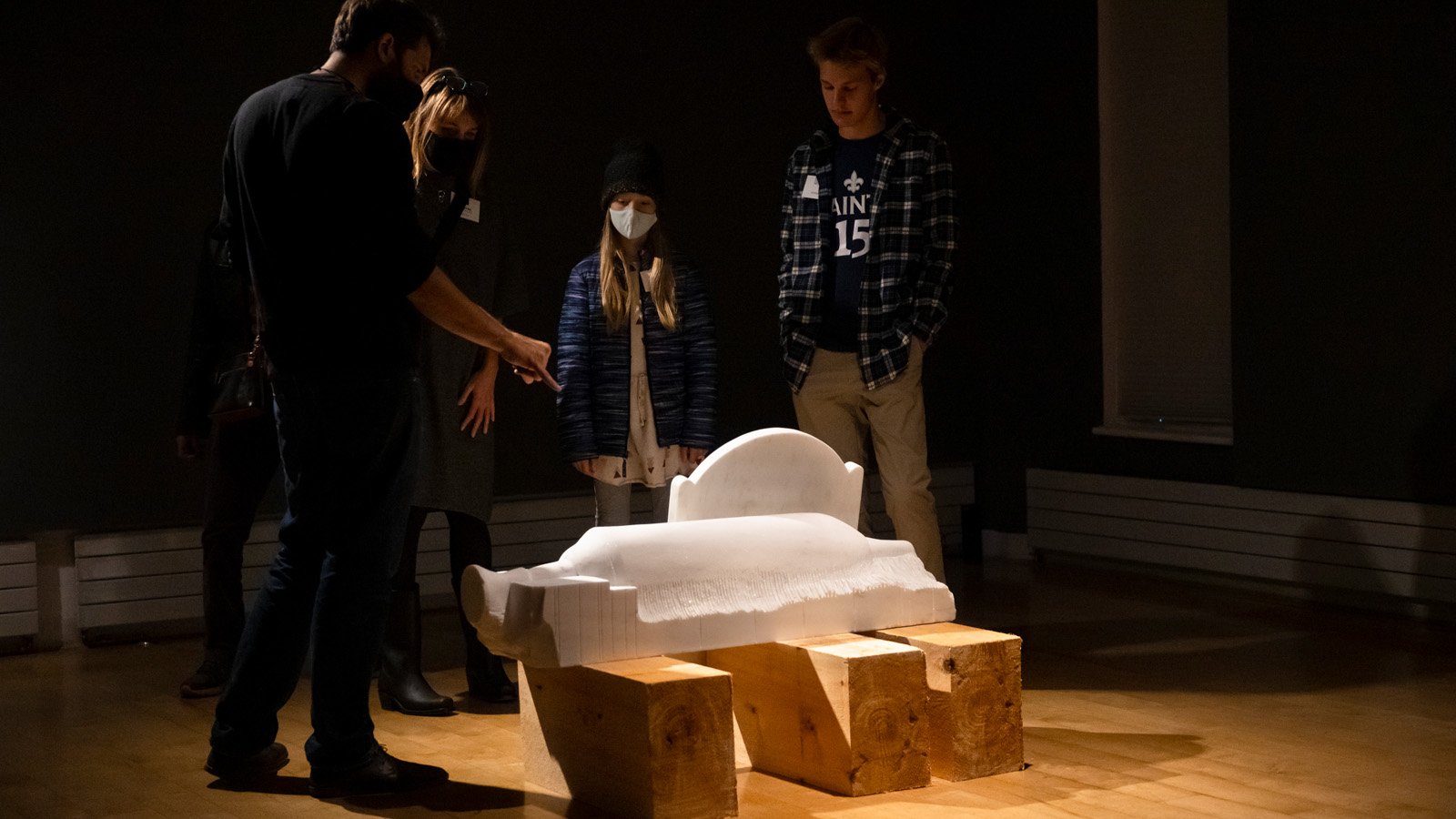 Objects of Empire BCA Center installation with people in gallery viewing marble carvings