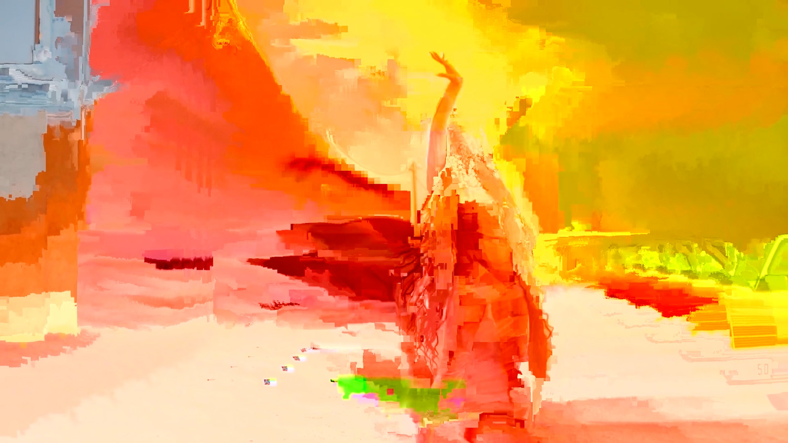 A multi-colored video still, with full screen glitch, of a woman dancing.