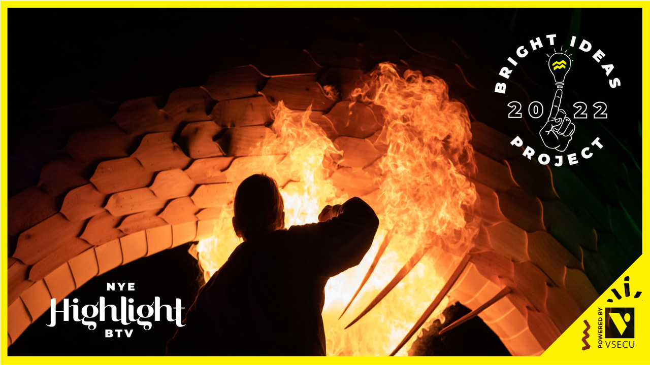 A photo of a man silhouetted against a wooden sculpture that he is setting ablaze. Highlight 2022 Bright Ideas Project Powered by VSECU