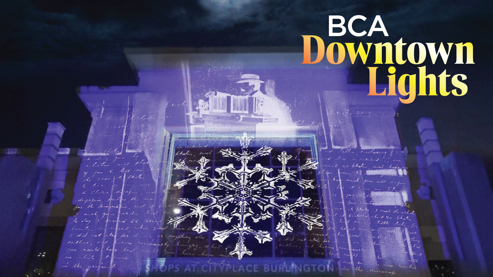 A photo of the lit up former City Place Mall in blue hues, the text reads "BCA Downtown Lights".