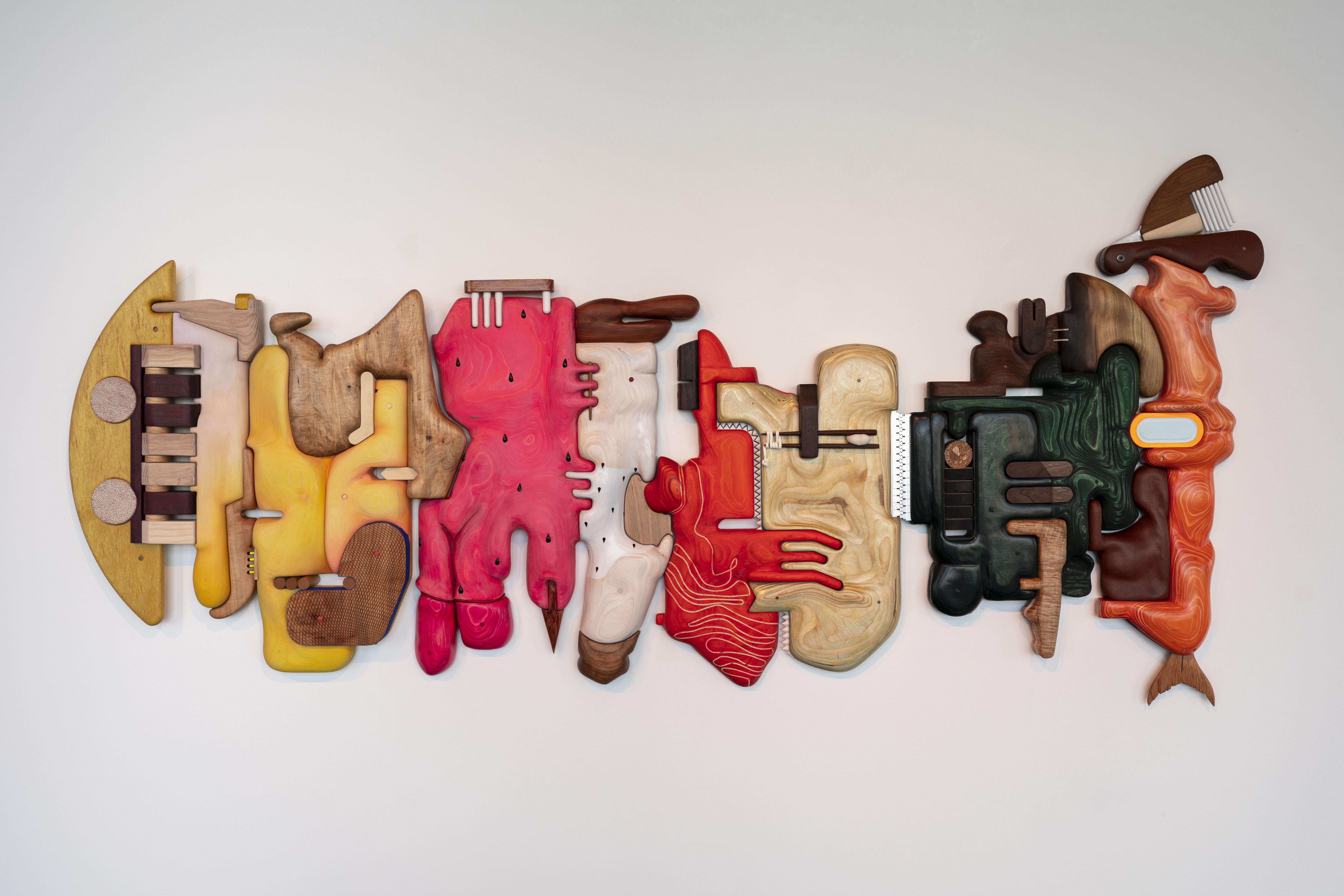 A photo of Grocery Conveyor by Cathy Della Lucia, a mixed media three-dimensional wall sculpture