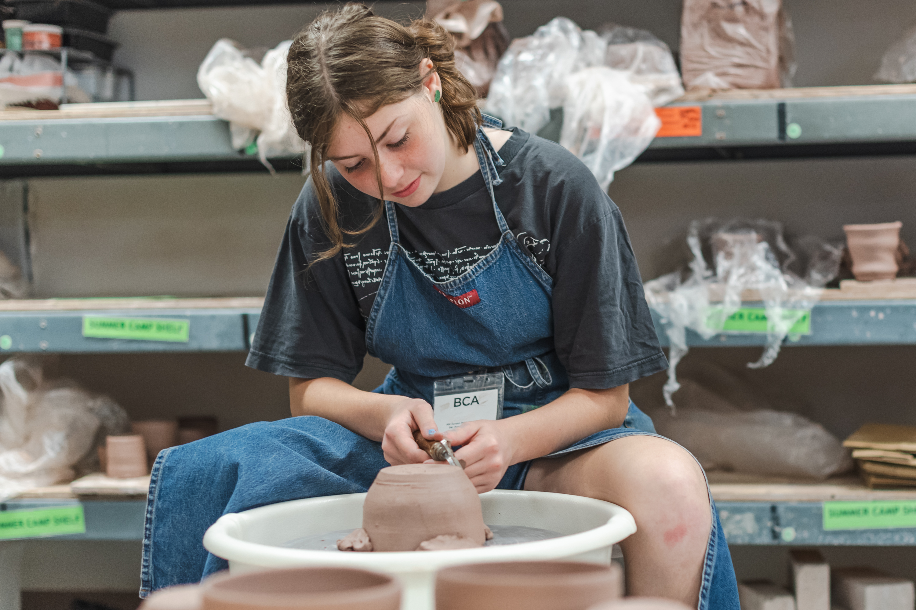 Photo of a young person creating pottery at BCA Studios