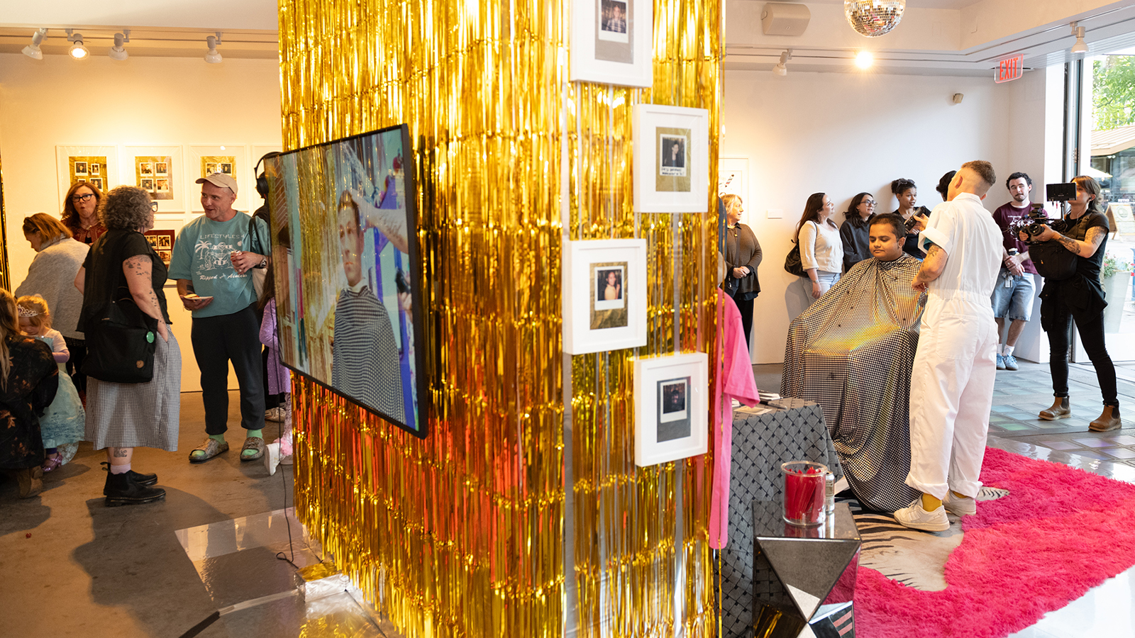 Artist Ace Lehner performing a live hair cut  during an artist reception at the BCA Center, a Contempoary Art Center