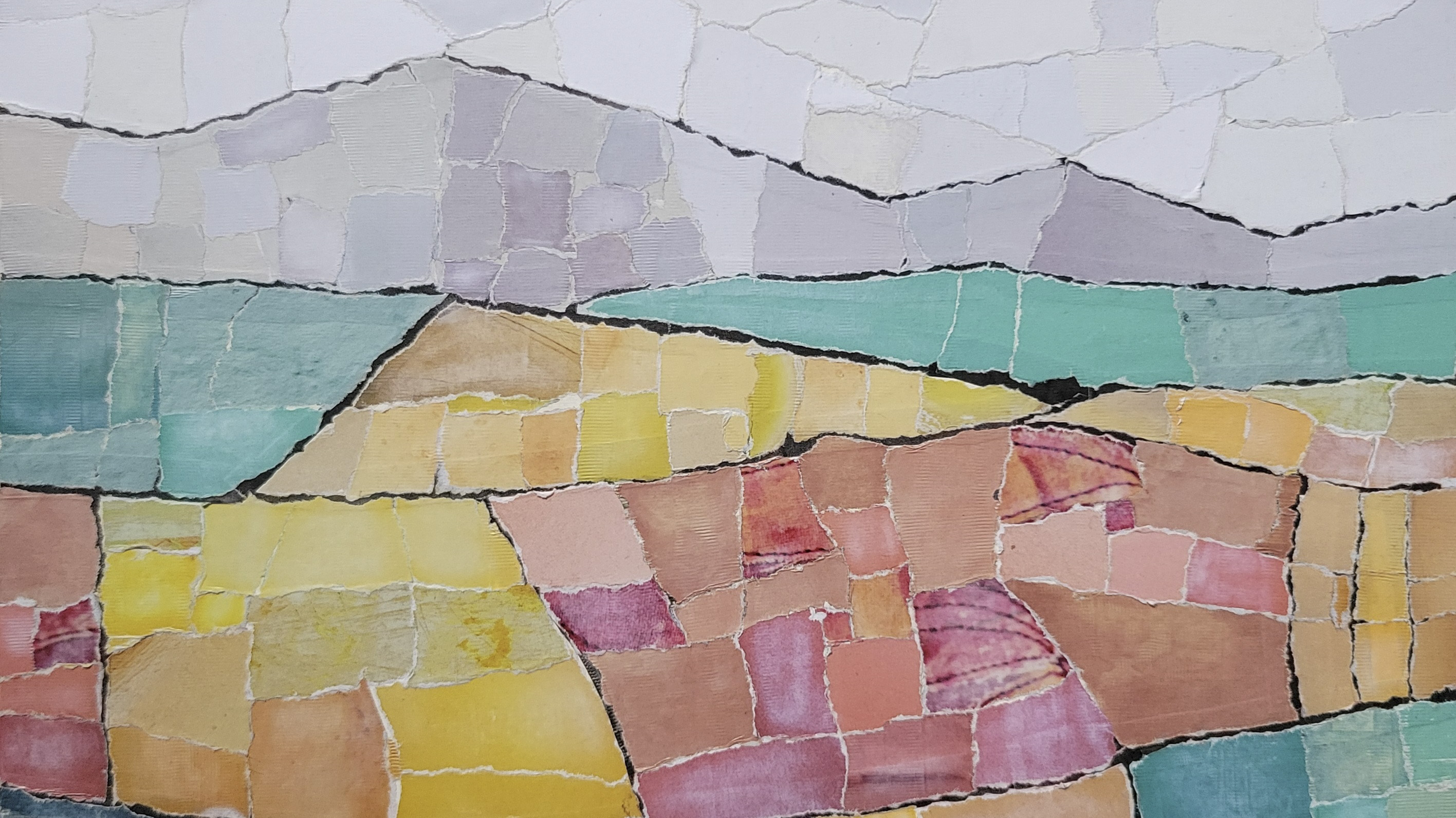 paper collage depicting mountains in geometric patterns