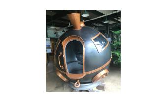 A round ball sculpture of a train engine