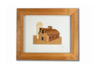 An image of a barn and a silo made out of wood in a wood shadow box
