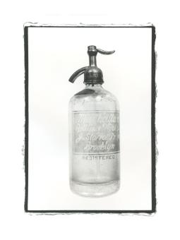B&W photograph of a seltzer bottle.