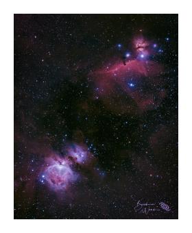 Photograph of the Orion nebulae in purples, blues, and deep magentas. 
