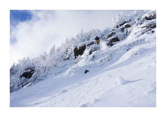 Photograph of a snowy mountain. 
