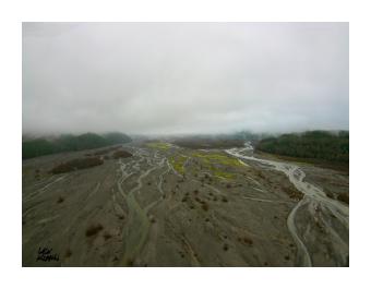 Aerial photograph of the blast zone of a volcano, greys and browns.