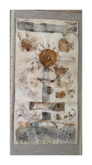 Abstract fabric collage depicting a garden in browns. 
