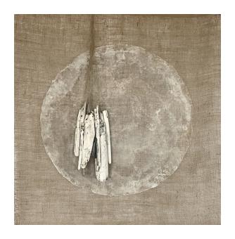 Mixed media depicting a dangling charm in front of a circle drawn in white.