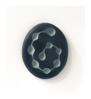 Flat ovular shape with a series of 8 indents connected by a line