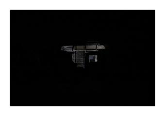 Photograph of a darkened house where the only imagery that invokes a house is the light coming through the dilapidation in the ceiling. 