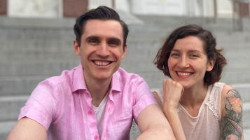 A head shot of Gina Stevenson and Quinn Rol sitting on the steps of Burlington's City Hall.