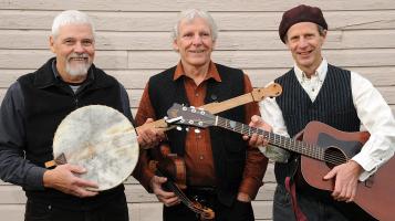 Members of band holding traditional Irish instruments