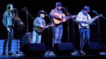 Kowal family band performing on stage