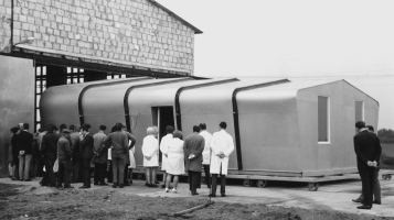 A group of people consider a modular structure.