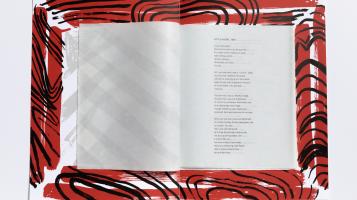 An image of an open book surrounded by an elegantly stylized red border.