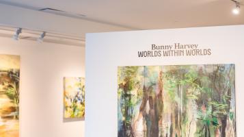 Bunny Harvey exhibition displaying wall text and oil paintings