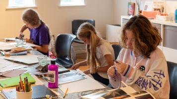 3 kids enjoying making in the BCA center for Summer Camp