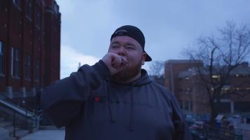 image of guy walking at twilight