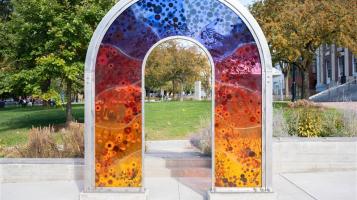 a photo of anthology by lydia kern, a multicolored acrylic and steel arch installation