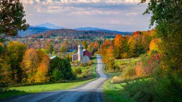 photograph of country road scene with fall colors and skyline
