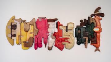 A photo of Cathy Della Lucia's mixed media sculpture "Grocery Conveyor", 2024