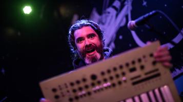 Willverine holds a sound mixer keyboard