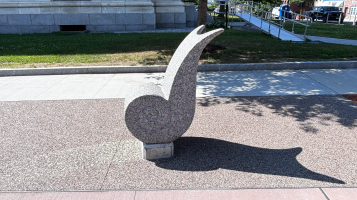 a photograph of Magnus, a statue of a stone snail