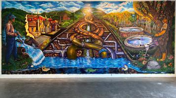 a photo of the mural our water our future, a colorful abstract depiction of water systems