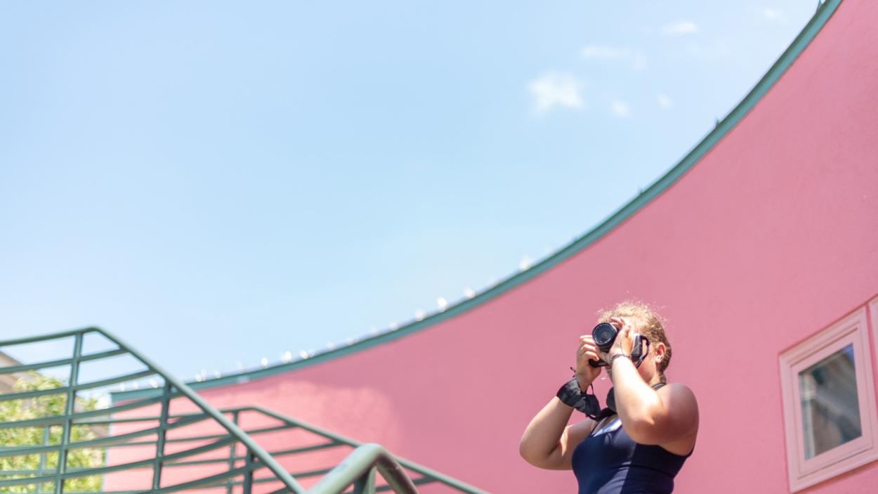 summercamp-2022.jpg a summer camp participant taking photos outside for Darkroom Photo