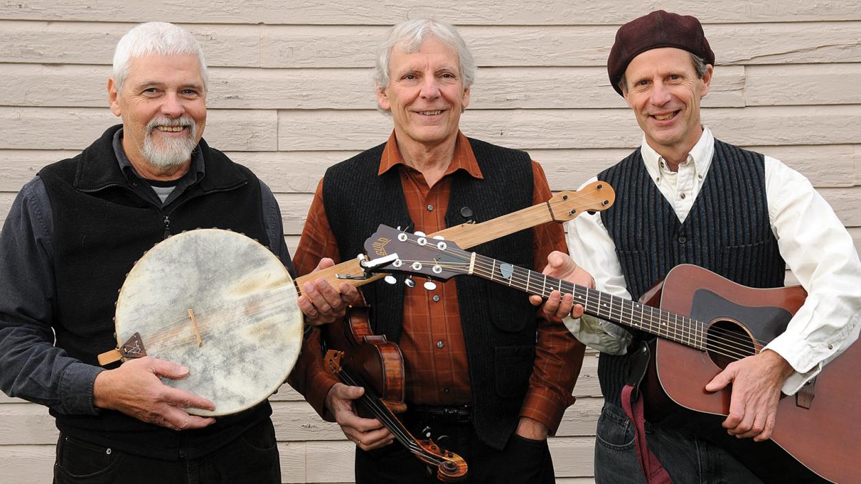 Members of band holding traditional Irish instruments