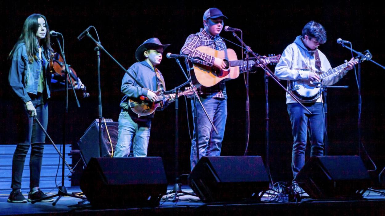 Kowal family band performing on stage