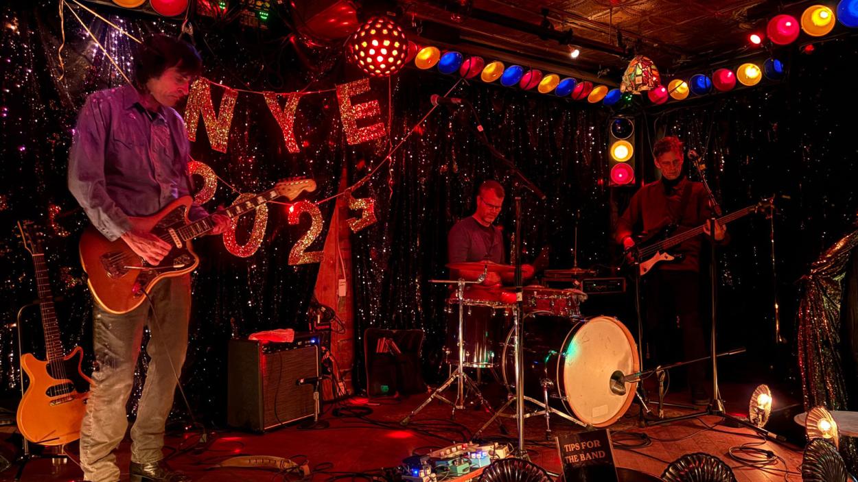 legendary surf band performs onstage at a new year's eve 2025 celebration