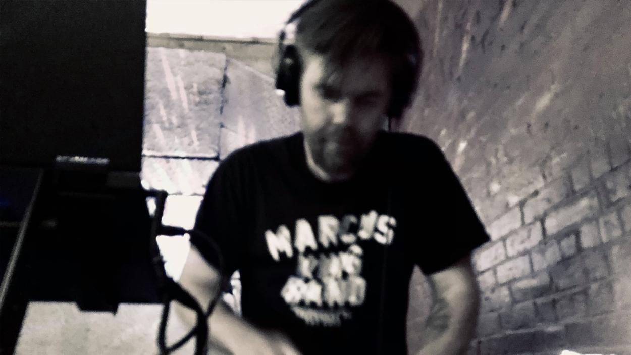 Black and white image of dj that is blurry