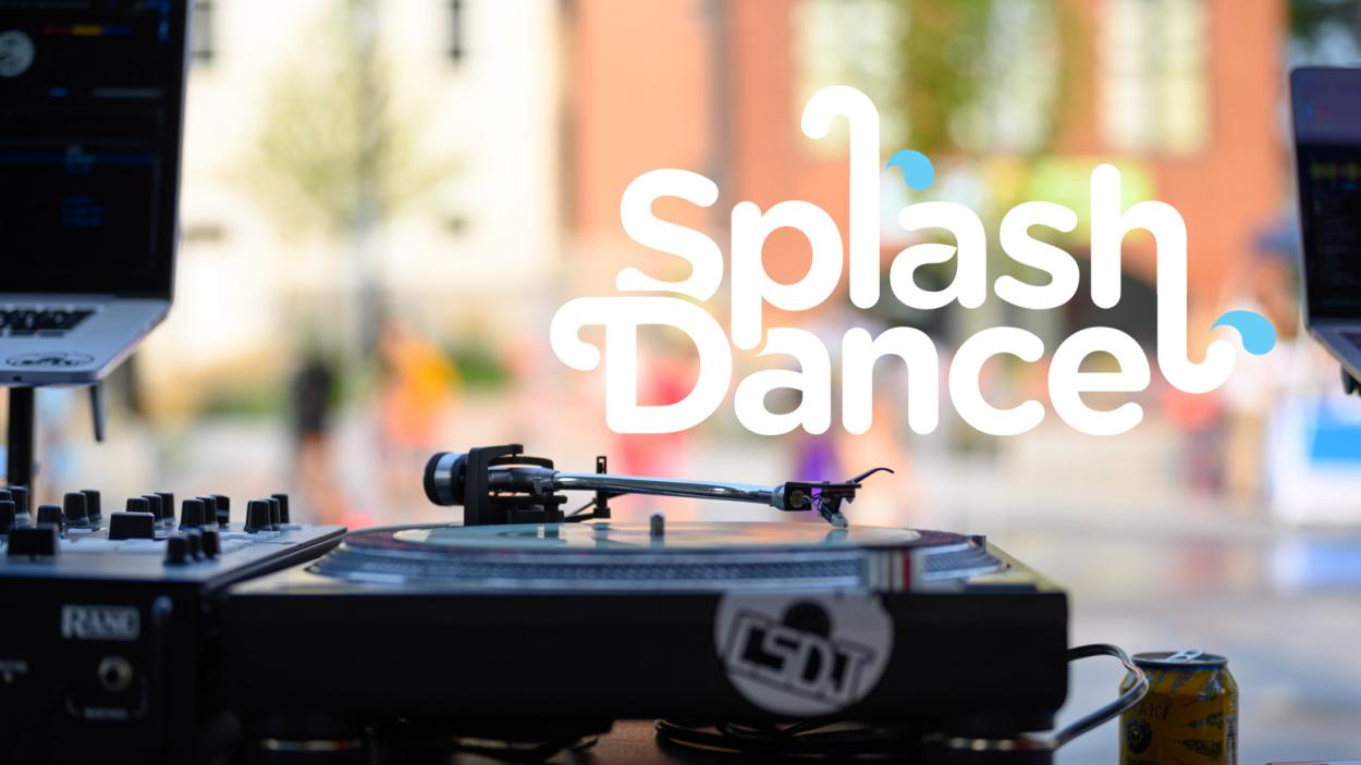 A tight crop of a deejay setup infront of an outdoor splash fountan
