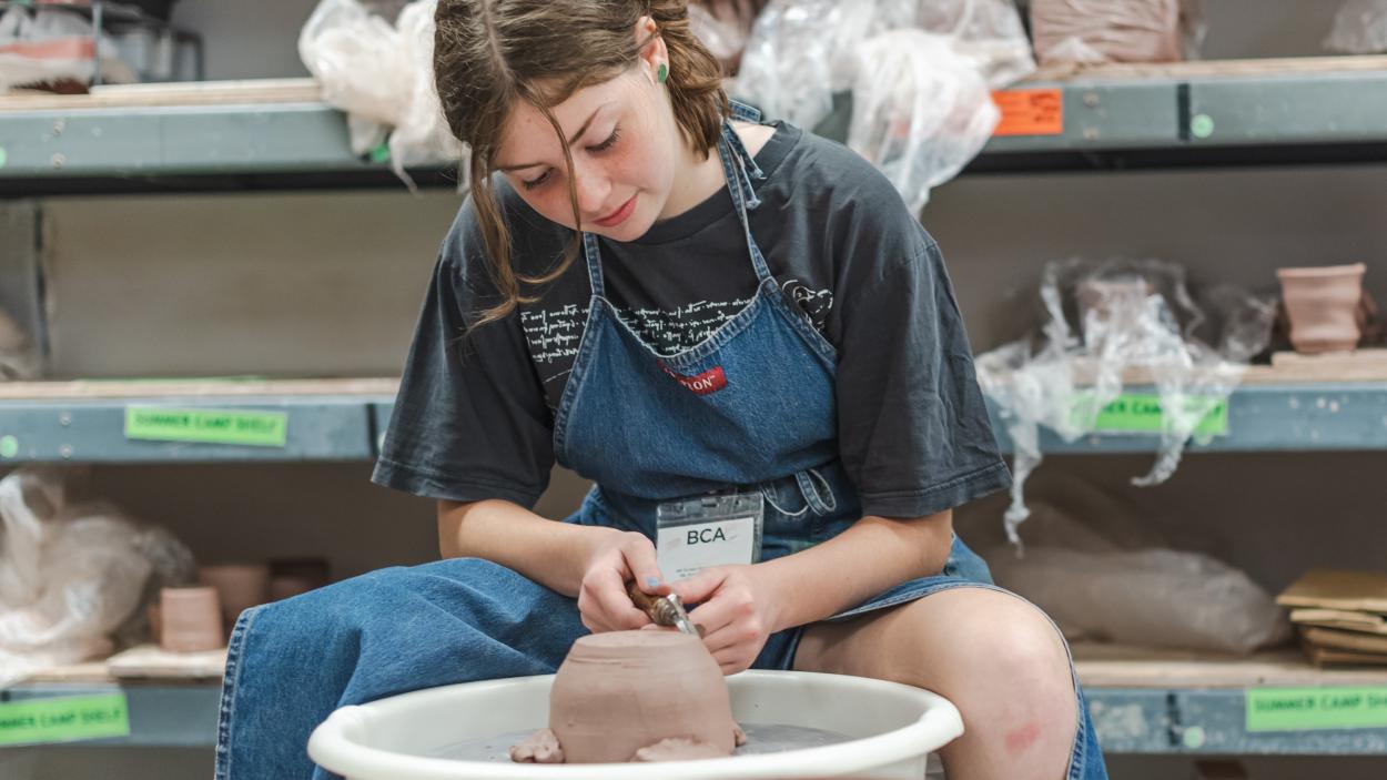 Photo of a young person creating pottery at BCA Studios