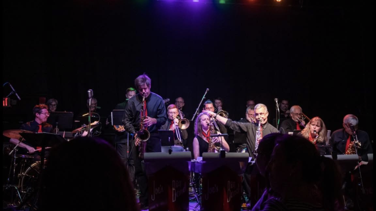 A 17-piece jazz ensemble performing a concert