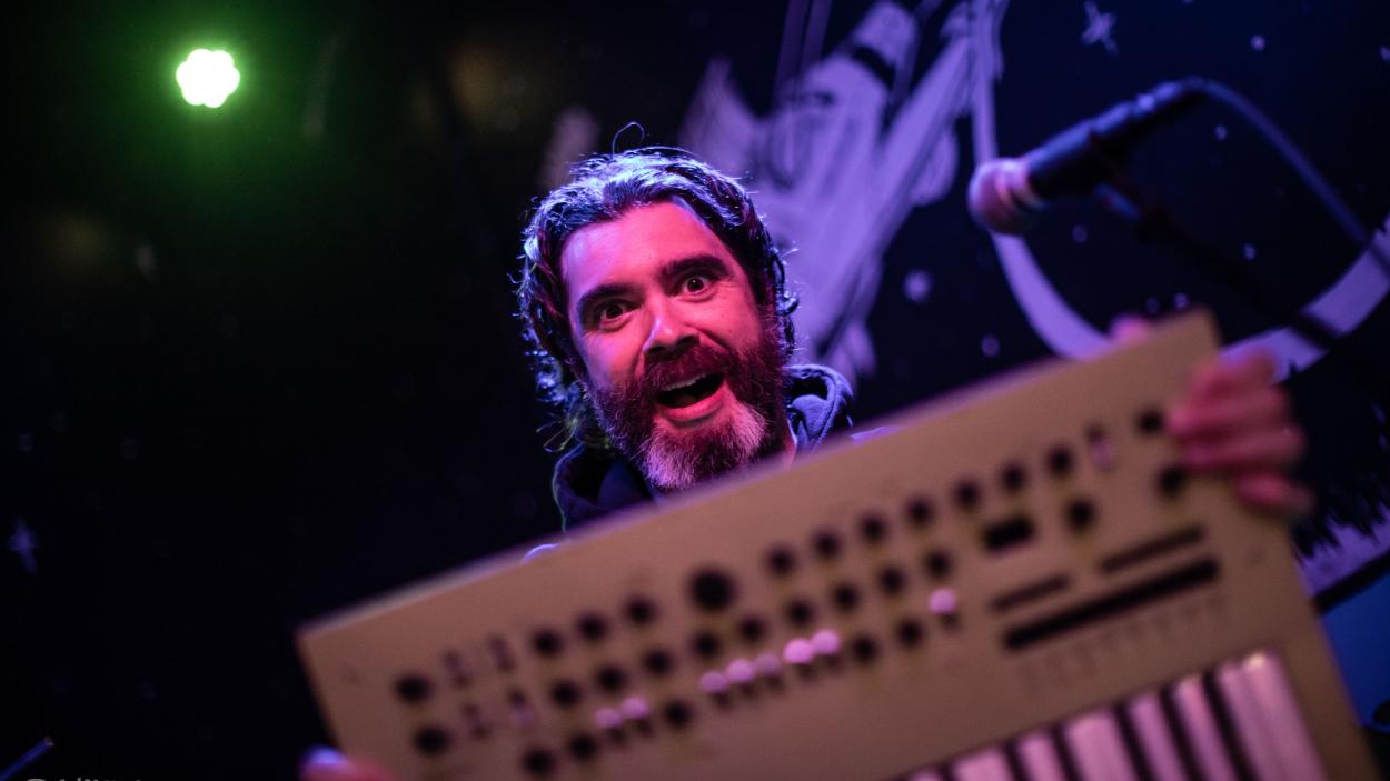 Willverine holds a sound mixer keyboard