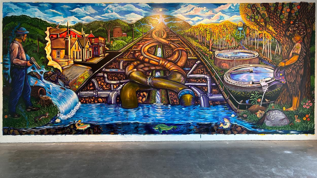 a photo of the mural our water our future, a colorful abstract depiction of water systems